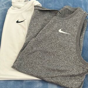 Two nike tanks perfect for a workoit